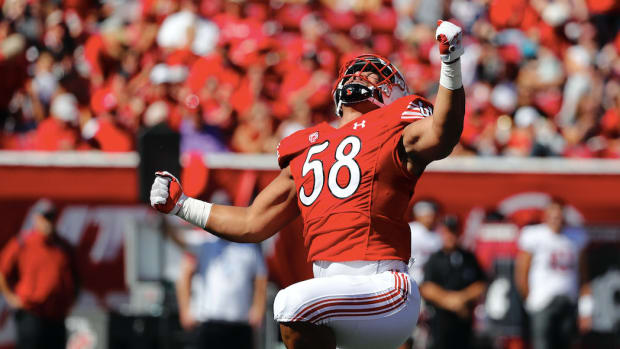 Sep 25, 2021; Salt Lake City, Utah, USA; Utah Utes defensive tackle Junior Tafuna (58) reacts after a sack in the first quarter on Washington State Cougars quarterback Jarrett Guarantano (18) in the first quarter at Rice-Eccles Stadium.